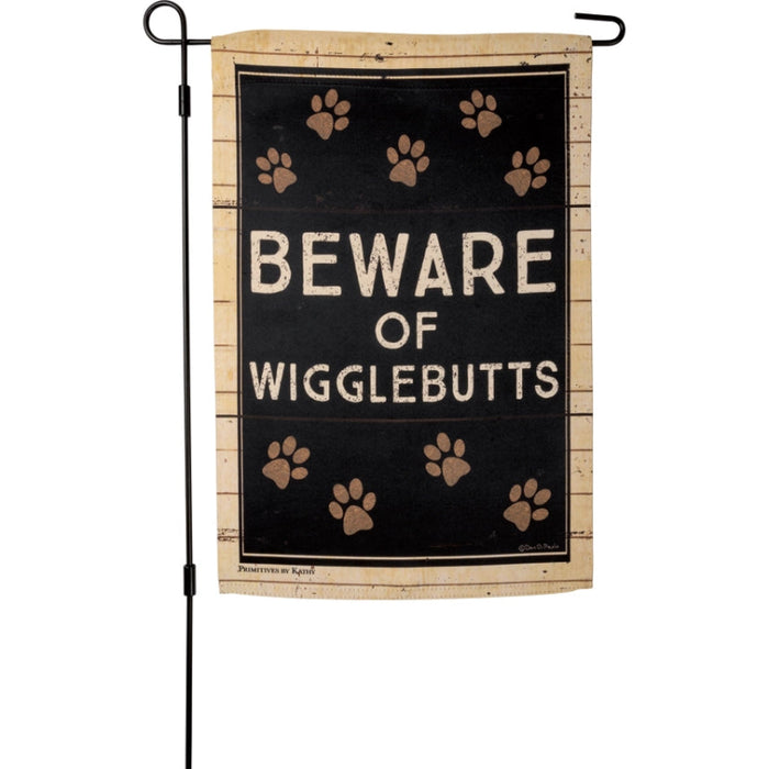 Garden flag with 'Beware of Wigglebutts' text and paw prints on a wooden looking background
