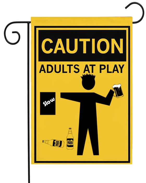 Garden flag with 'Caution: Adults at Play' text and graphics on a yellow background.