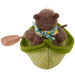 felted bear in a green boat with a paddle on a white background
