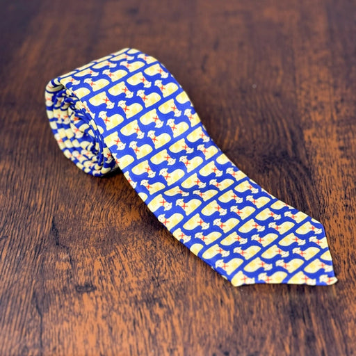 silk necktie with a blue background and repeated butter lamb pattern