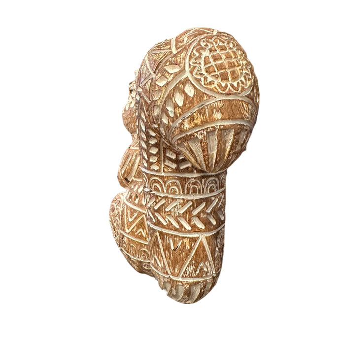 Decorative squirrel figurine with intricate floral-like patterns on a white background