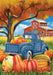 Decorative flag with a blue truck, pumpkins, and barn scene on an autumn background.