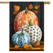 Decorative flag with pumpkins and leaves on a wooden look background