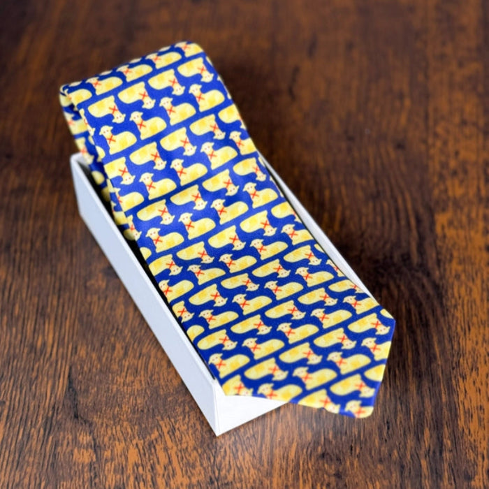 silk necktie with a blue background and repeated butter lamb pattern