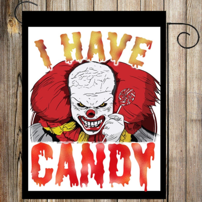 garden flag with a scary clown saying "i have candy"