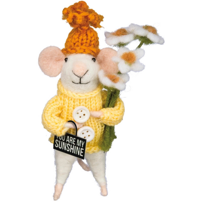 Stuffed mouse toy wearing a yellow sweater and hat, holding flowers and holding a sign