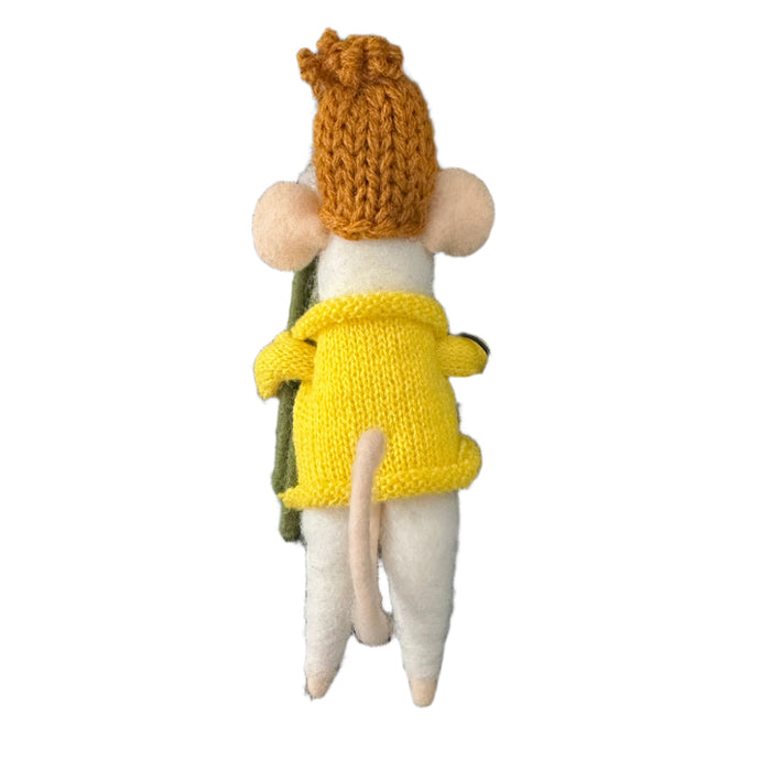 Stuffed mouse toy wearing a yellow sweater and hat, holding flowers and holding a sign
