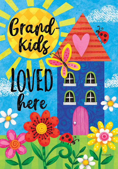 Decorative flag with colorful house, flowers, and text 'Grand kids loved here' on a blue background.