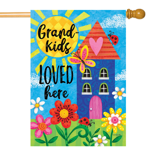 Decorative flag with colorful house, flowers, and text 'Grand kids loved here' on a blue background.