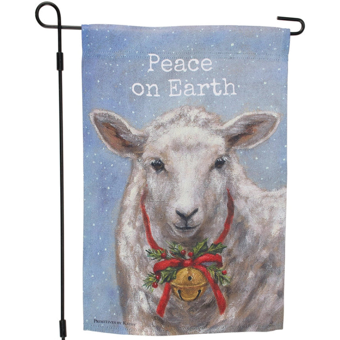 Decorative garden flag with a sheep wearing a Christmas wreath and bell, featuring the text 'Peace on Earth'.
