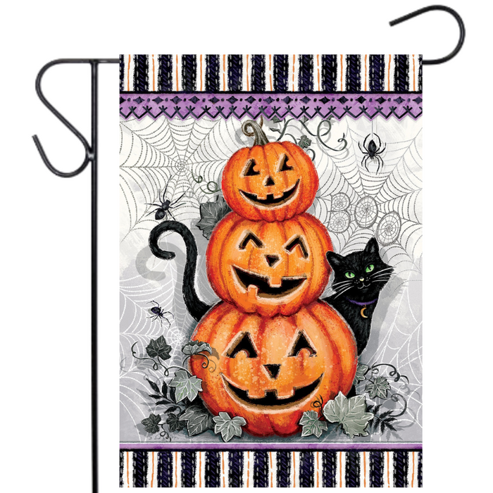 Halloween-themed garden flag with pumpkins, a cat, and spider webs on a purple and black striped background.