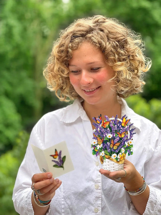 Paper Bouquet of lavender and daisies with butterflies in a white basket that comes with a greeting card