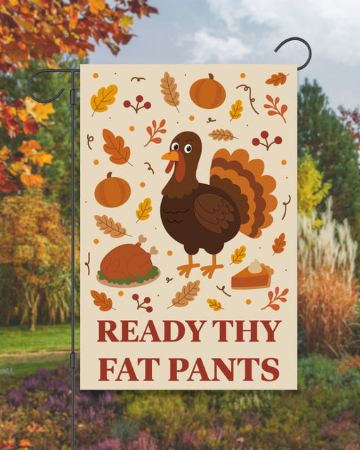 Decorative garden flag with a turkey and fall-themed elements on a beige background.