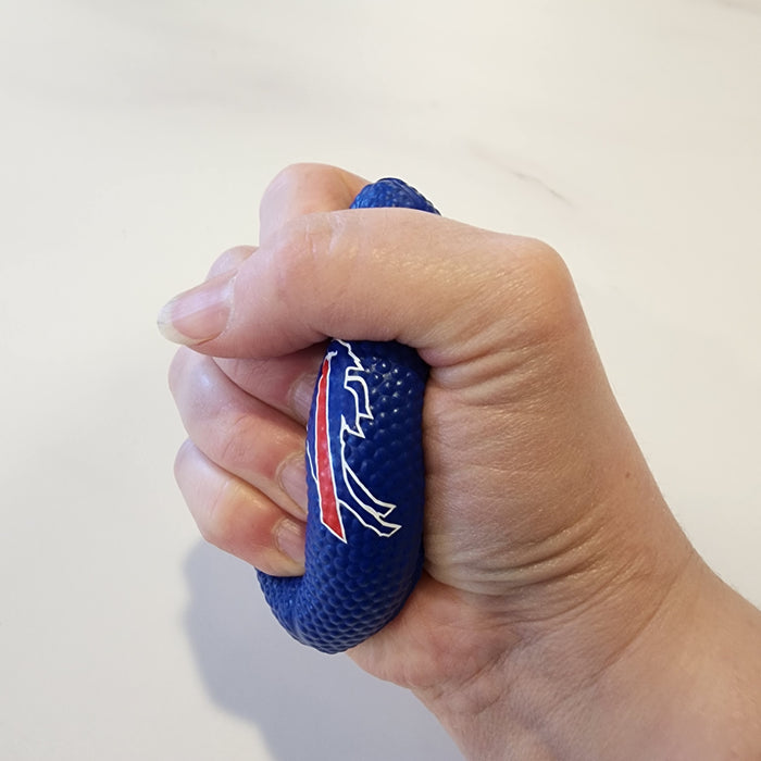 A hand gripping a textured blue stress ball with a red and white buffalo logo, shown against a plain off-white background.