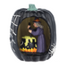 Halloween-themed figurine with a witch inside a pumpkin, brewing her cauldron