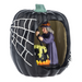 Halloween-themed figurine with a witch inside a pumpkin, brewing her cauldron