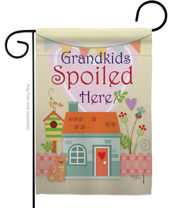 Decorative garden flag with a house, cat, and birdhouse design, featuring the text 'Grandkids Spoiled Here'.