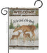 Decorative flag with deer family and 'Welcome to Our Neck of the Woods' text on a pine themed background.