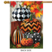 Decorative flag with pumpkins and autumn leaves on a wooden look background