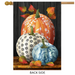 Decorative flag with pumpkins and leaves on a wooden look background
