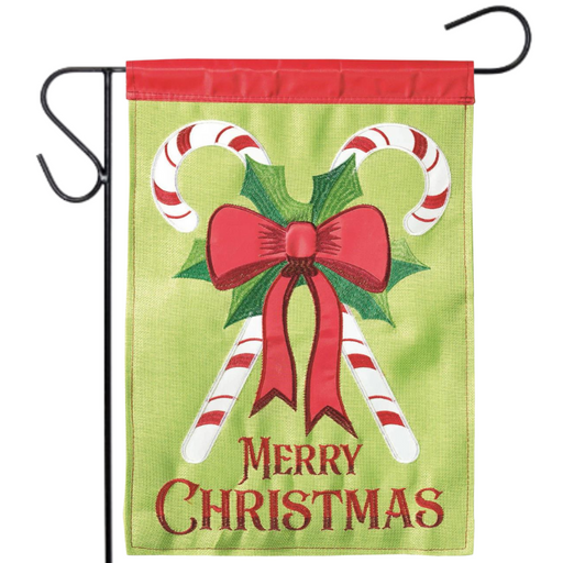 Christmas-themed garden flag with candy canes, bow, and 'Merry Christmas' text on a green background.