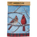 Garden flag with two cardinals on a branch against a blue sky background and snow