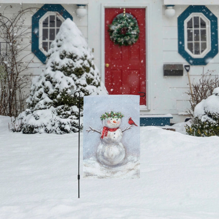 Decorative garden flag with a snowman wearing a red scarf and green wreath, and a cardinal bird on a snowy background.