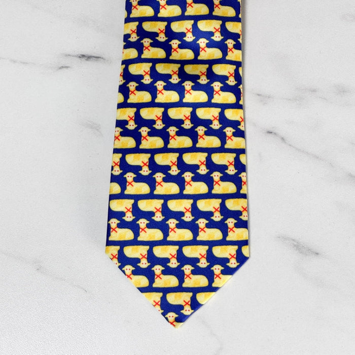 silk necktie with a blue background and repeated butter lamb pattern