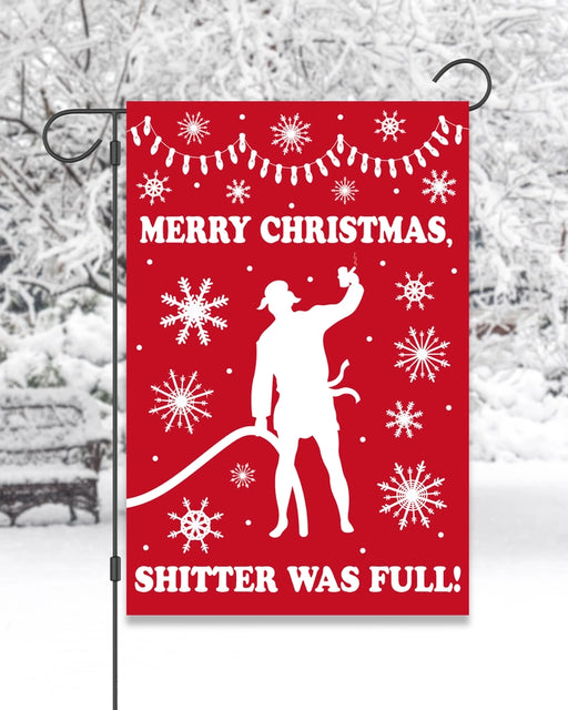 Red Christmas garden flag with a silhouette of a person and snowflakes with text saying "merry Christmas, shitter was full!"