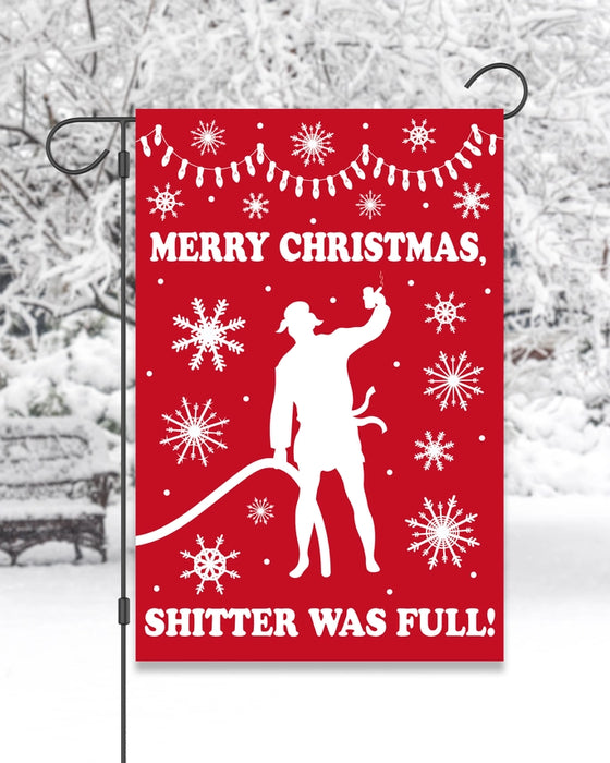 Red Christmas garden flag with a silhouette of a person and snowflakes with text saying "merry Christmas, shitter was full!"