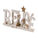 Decorative nativity scene with 'BELIEVE' letters on a white background