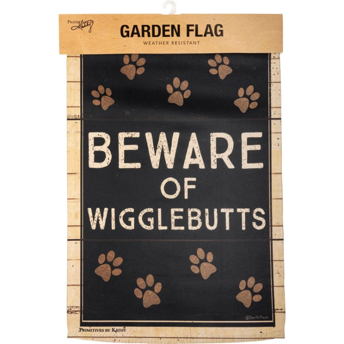 Garden flag with 'Beware of Wigglebutts' text and paw prints on a wooden looking background