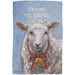Decorative garden flag with a sheep wearing a Christmas wreath and bell, featuring the text 'Peace on Earth'.