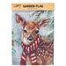 Garden flag with a deer wearing a red and white striped scarf against a snowy background with pine trees