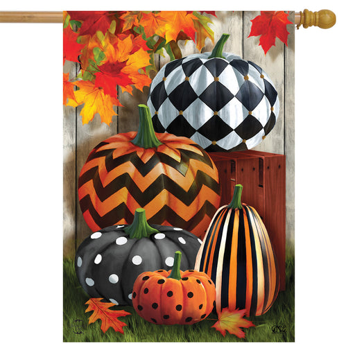 Decorative flag with pumpkins and autumn leaves on a wooden look background
