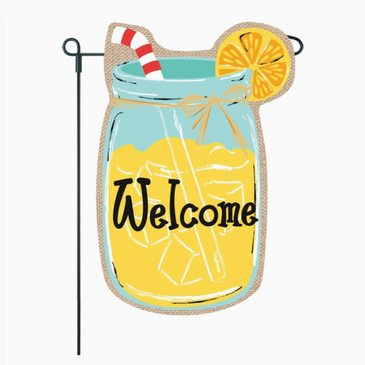 Decorative garden flag with a mason jar design, straw, lemon slice, and 'Welcome' text on a burlap background.