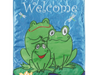 three frogs sitting on lily pad flag with "welcome" at the top