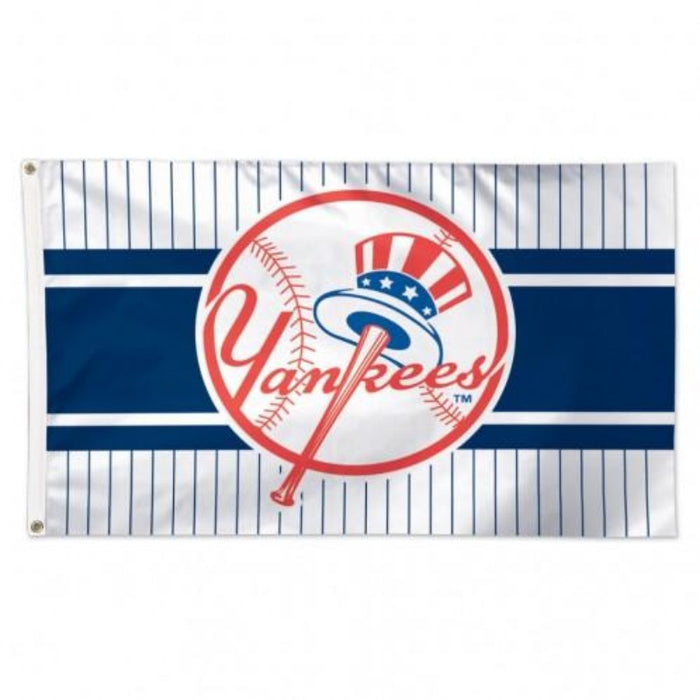 blue and white pinstripe flag with a baseball and yankees logo in the center