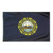 bluie flag with the state seal in the center with a boat scene