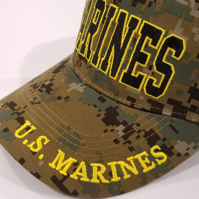 marines embroidered black letter in yellow outline on green camo hat with marines on brim