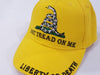 bright yellow hat with the don't tread on me insignia