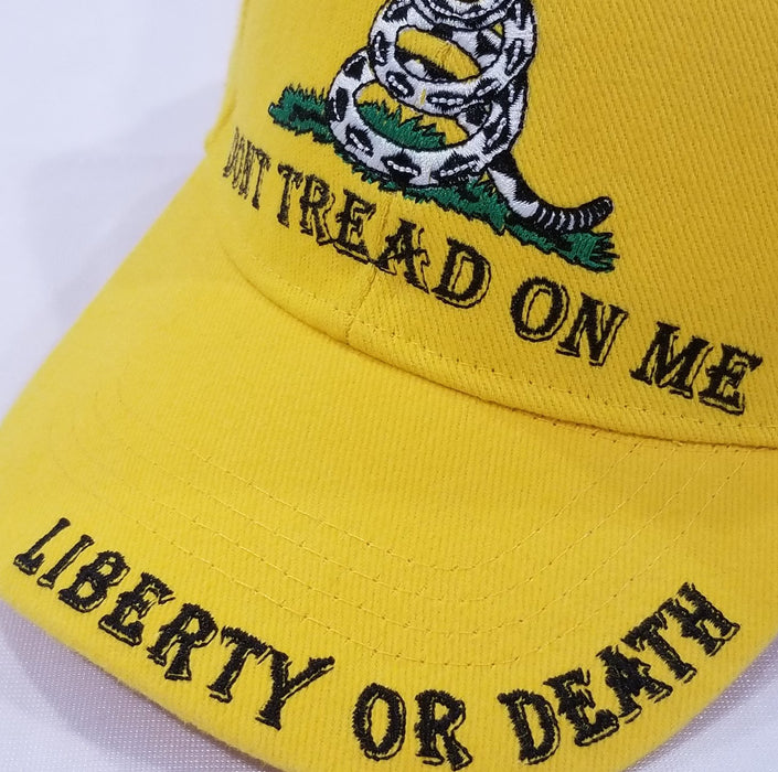 bright yellow hat with the don't tread on me insignia