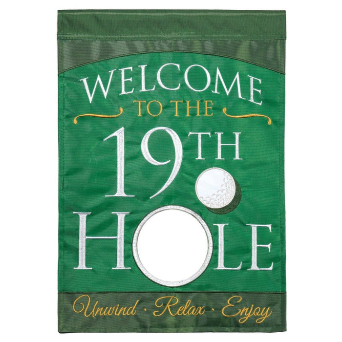 green flag with gold ball almost in reading "welcome to the 19th hole; unwind, relax, enjoy"