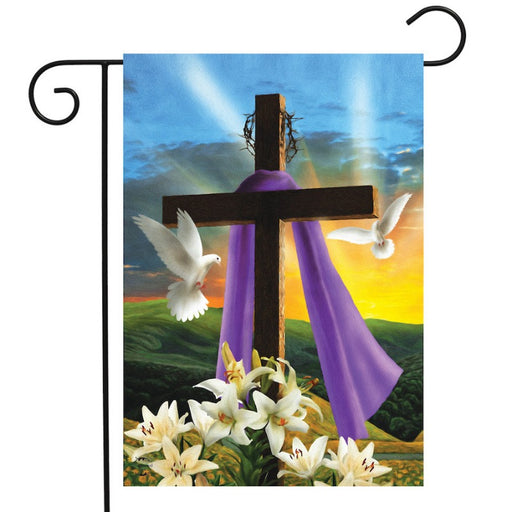 sunset on a flag with a cross and white doves and lilies