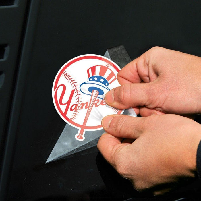 photo showing the application of the decal on a car window