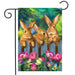 three bunnies behind a fence on a flag with colorful flowers in the front
