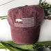 MAROON VERSION OF THE HAT WITH A BUFFALO IN THE FLAG CANTON AREA AND STRIPES. EMBROIDERED 