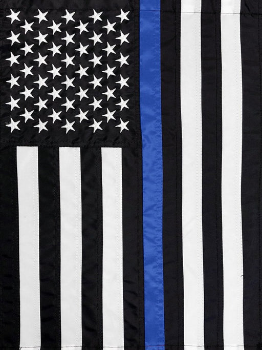 black and white american flag with a single blue stripe down the center