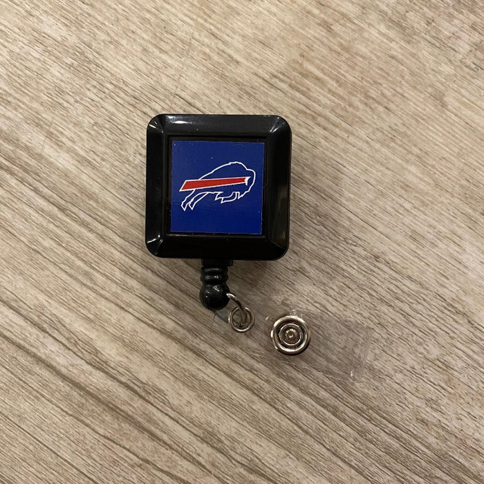 retractable buffalo bills badge holder with blue background and clear badge clasp