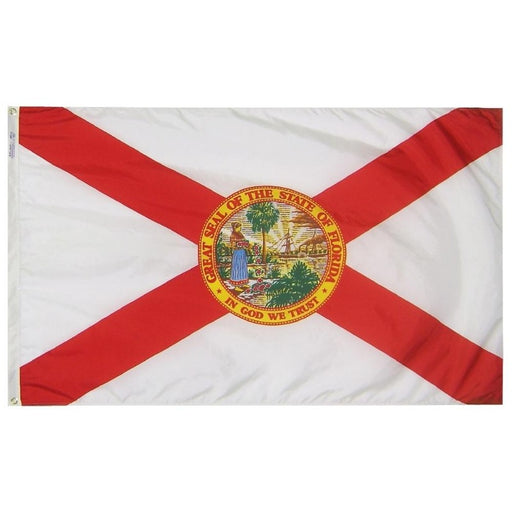 white flag with a red cross and the florida state seal